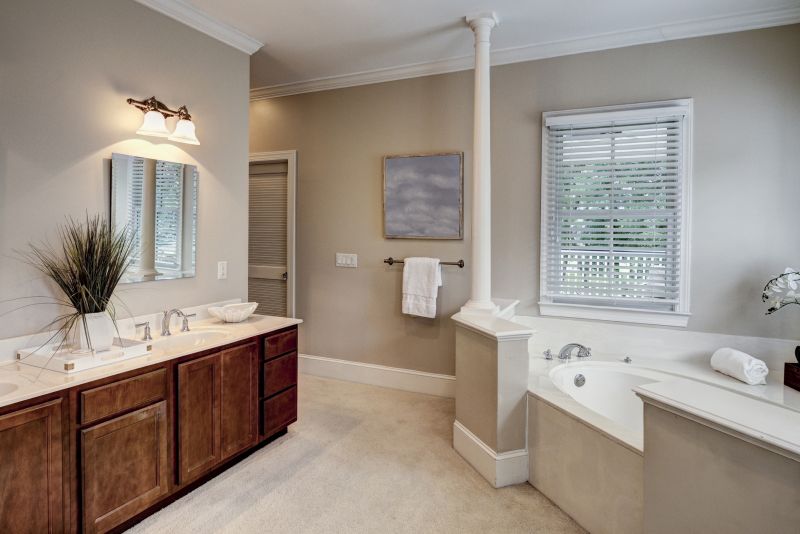 Bathroom with custom cabinetry and elegant lighting